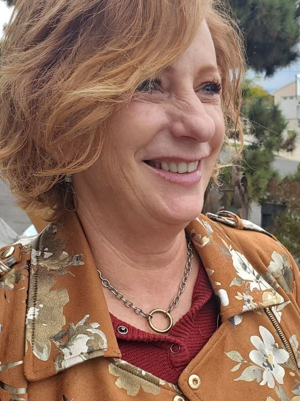 female wearing short silver chunky chain necklace